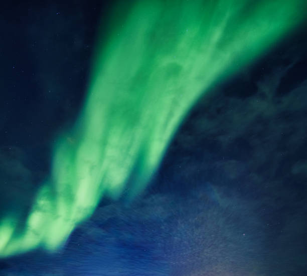 istock Bright and active Aurora borealis or Northern lights glowing in the night sky on Arctic circle 1659128974