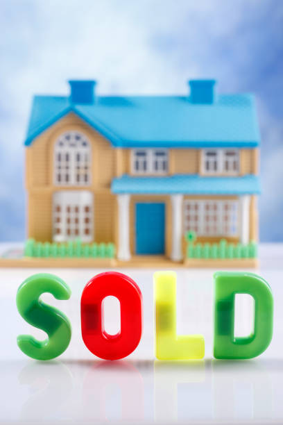 small toy house with the single word sold small toy house with the single word sold for sale sign information sign information symbol stock pictures, royalty-free photos & images