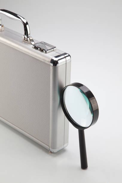 istock Aluminum brief case with the magnifier glass 1659138565