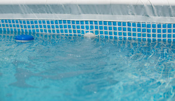 istock Swimming pool with chlorine dispenser 1659140686