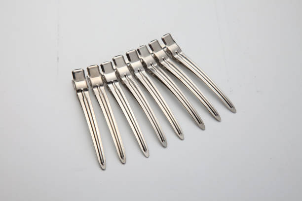 silver hair-pin eight silver hair-pin in a row on plain background hair clip stock pictures, royalty-free photos & images