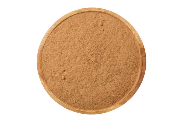 istock Bowl of ground cinnamon isolated on white background 1659161778