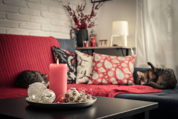 istock Christmas decorations with candle on coffee table 1659162384