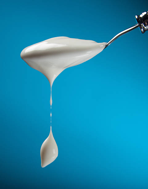 Spoon with yogurt stock photo