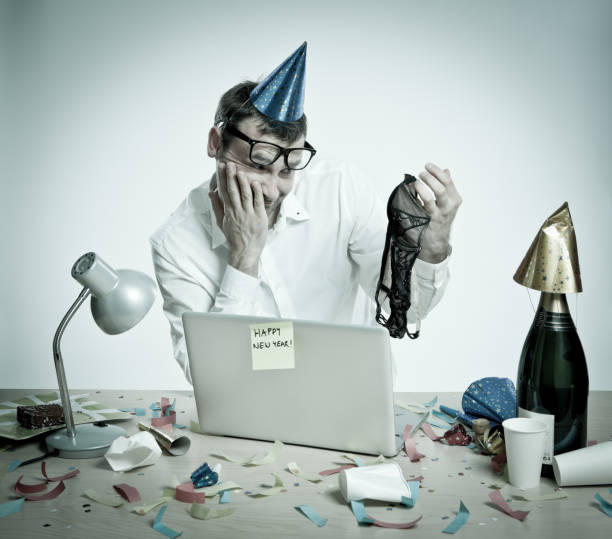 istock Confused man in office interior after New Year's Day party 165918470