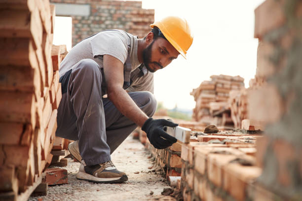 istock Using the leveler. Handsome Indian man is on the construction site 1659184716