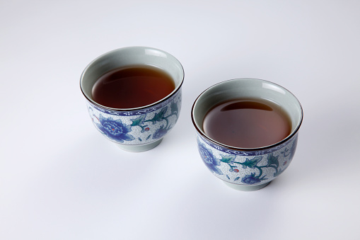 retro-styled Chinese tea cup isolated on white.