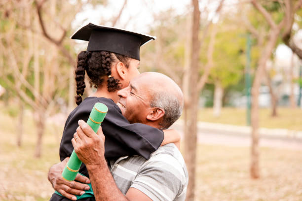 istock Family in the preschool graduation cerimony 1659189708