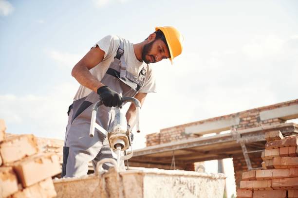 istock Mixes concrete. Handsome Indian man is on the construction site 1659196372