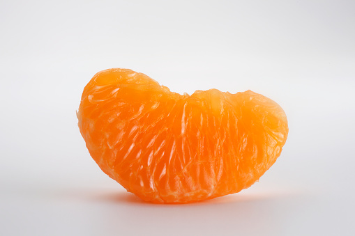 close up of the peeled mandarin orange segment