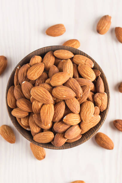 istock Raw peeled almonds in brown bowl 1659234766