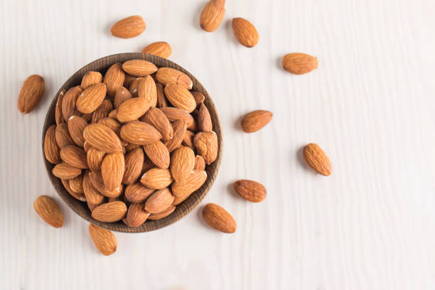 istock Raw peeled almonds in brown bowl 1659234770