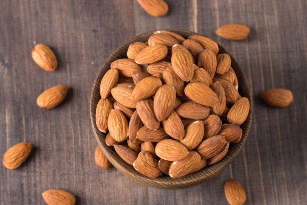 istock Raw peeled almonds in brown bowl 1659234813