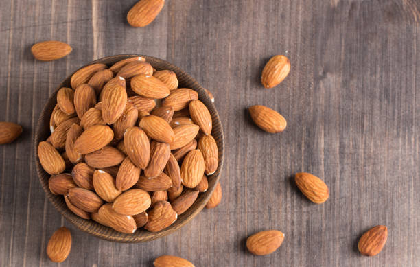 istock Raw peeled almonds in brown bowl 1659234827