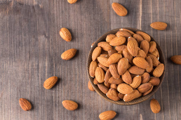 istock Raw peeled almonds in brown bowl 1659235353
