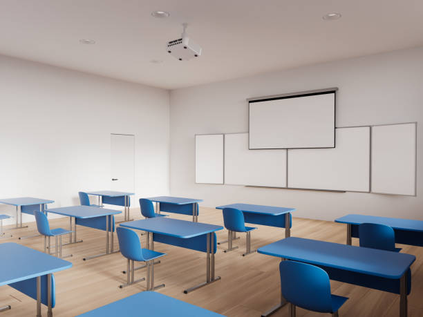 istock Stylish classroom interior with table in row and chalkboard with screen mockup 1659238359