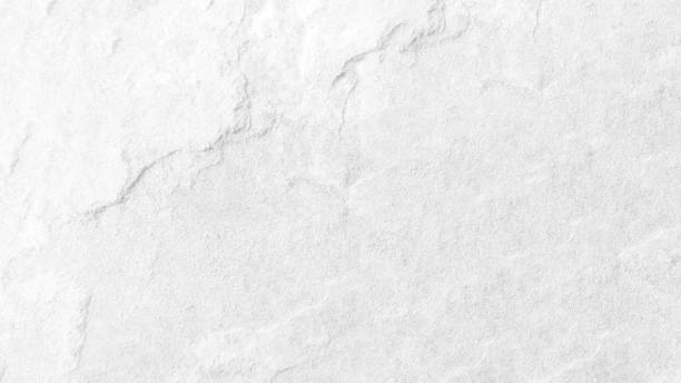 istock White wall surface of the white stone texture rough, gray tone. Use this for wallpaper or background image rock backdrop. There is a blank space for text. 1659264116