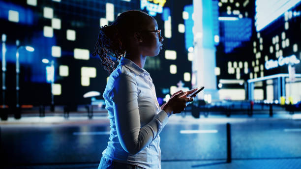 istock Woman texting and walking on street 1659271249