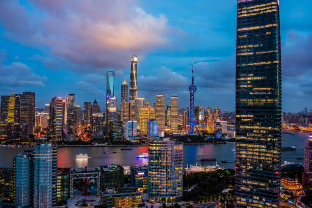 Aerial view of city skyline and modern buildings in Shanghai at night, China.