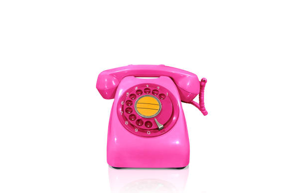 istock Old fashioned pink desk phone isolated on white background. 1659285953