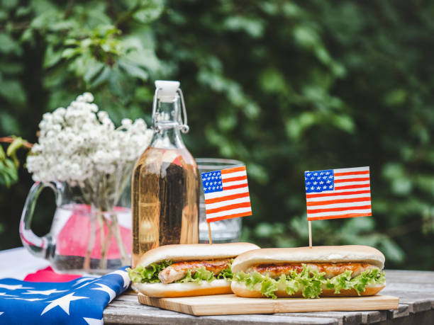 istock Two delicious hotdogs, homemade lemonade. Day light 1659287021