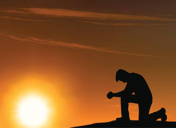 istock Background of an outlined kneeling man in front of a sunset 165930018