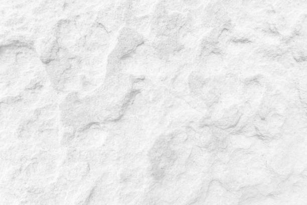 istock White wall surface of the white stone texture rough, gray tone. Use this for wallpaper or background image rock backdrop. There is a blank space for text. 1659303282