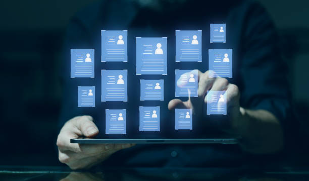 istock Human resources technology concept. HR manager male hands select personnel application form profiles for work on digital tablet. 1659310123