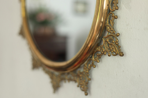 the old vintage mirror in the form of circle