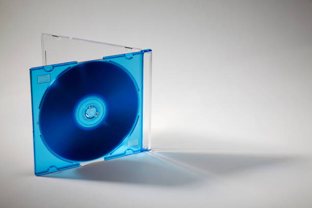 dvd in clear plastic DVD case Studio shot of plastic CD or DVD case on plain background clear cd case stock pictures, royalty-free photos & images