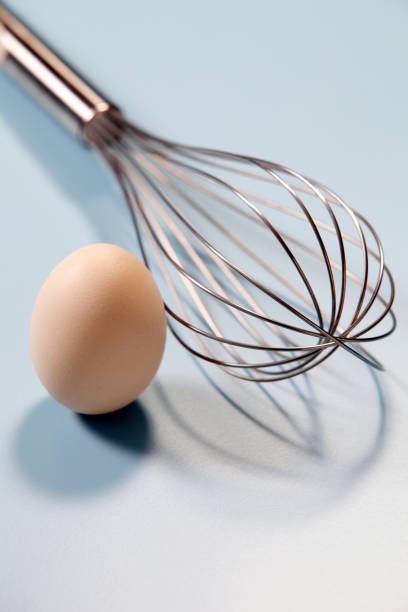 istock close up of the egg and whisk 1659335531
