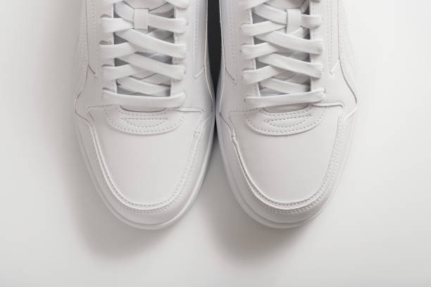 istock White sneakers on a white background. View from above. 1659337664