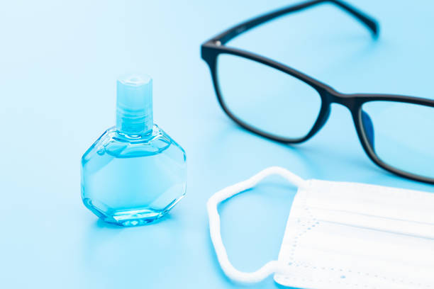 istock Eye drops, glasses and mask on blue background. 1659343226