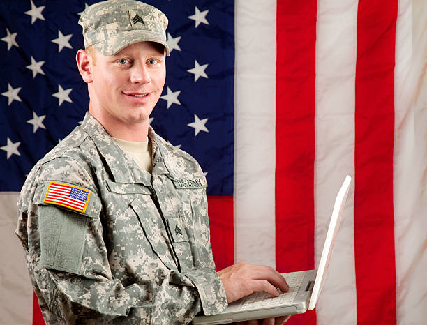 American Soldier Series: Young Sergeant with Laptop American soldier with laptop. us military photos stock pictures, royalty-free photos & images