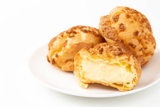 istock Tasty cream puffs on a white background. 1659348192