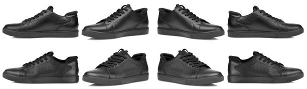 black leather sneakers on a transparent white background