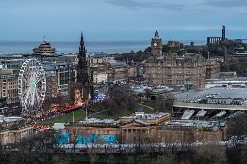 Edinburgh, United Kingdom – January 04, 2023: A scenic view of Edinburgh, England at dusk, as seen from the top of a hill
