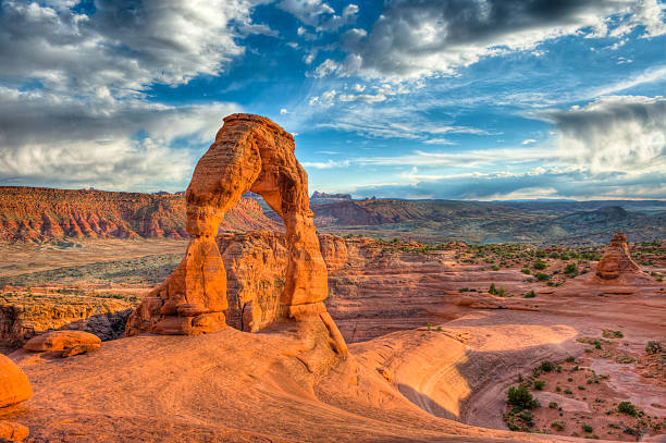 Delicate Arch, Arches National Park Delicate Arch, Arches National Park. The photo was taken with the HDR technique which combines photos taken at different exposure and blended together. It was postprocessed to maintain great details in the shadows and in the highlights and by keeping  at the same time  a natural look. natural bridges national park photos stock pictures, royalty-free photos & images
