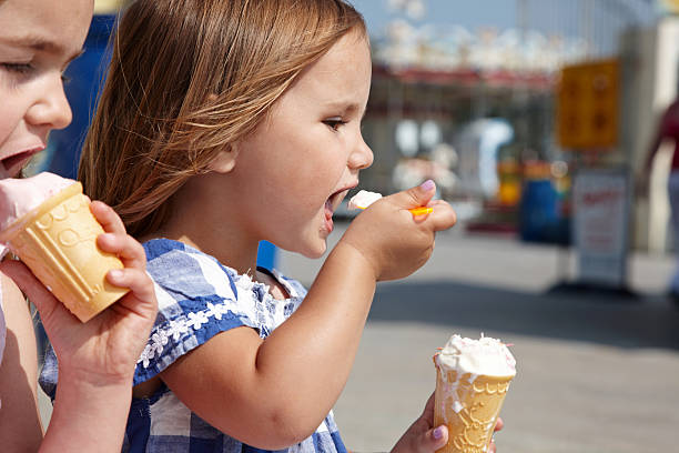 istock Two young girls eating ice cream cornets 165942717