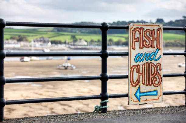 Fish and chips sign at typical UK seaside resort