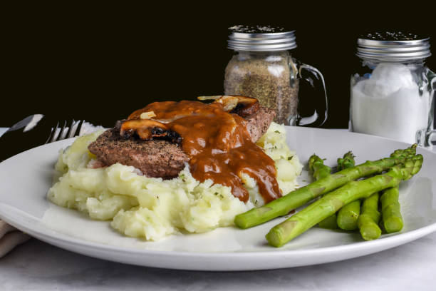 istock steak top with mushrooms and onions  on mash potatoes 1659440478
