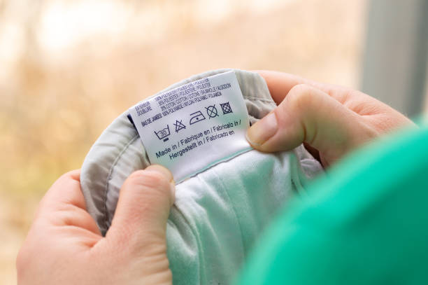 istock reading the washing instructions on the clothing label 1659443782