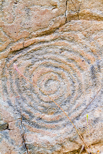 The geometric rock carvings of El Paso represent enormous spirals, concentric circles or other abstract figures. To explain their meaning there are a variety of theories: worship of the sun, of the water or the goddess of springs. But nowadays the researchers consider them directly related to religious practices associated with water of fertility rites. El Paso, La Palma, Canary Islands, Spain.