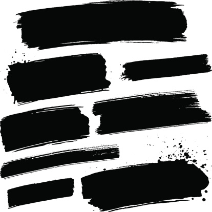 Various black grunge paint brush strokes on a white background.
