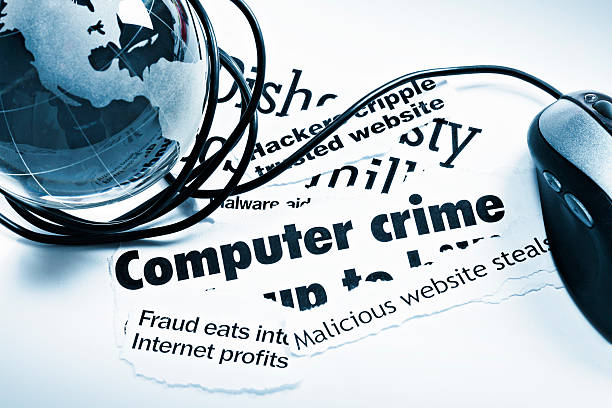 istock Blue glass globe paperweight, mouse on computer crime headlines 165945119
