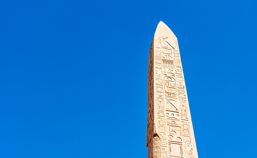 Obelisk of Thutmose I set against a blue sky