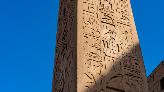 Close up of the Obelisk of Thutmose I set against a blue sky