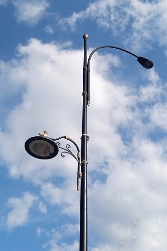Street Light Pole Against Blue Sky.
