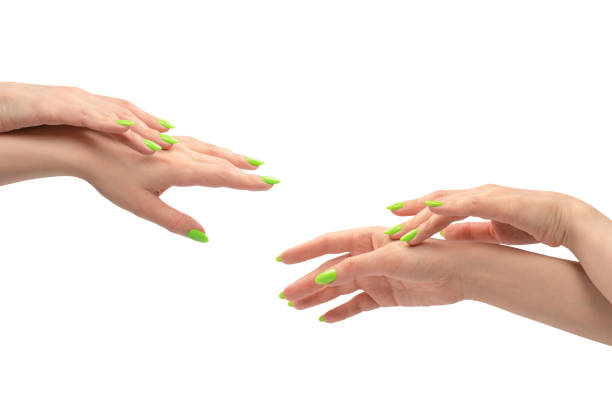 istock Hand of a woman with green naols hold some tiny or thin object. 1659499615