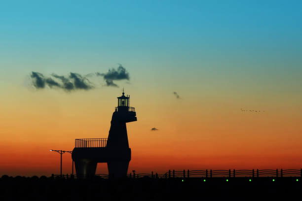 istock a night view of a lighthouse 1659500780